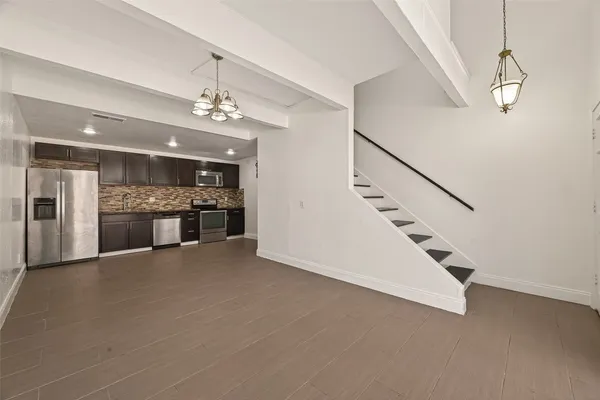 a view of a hallway with staircase