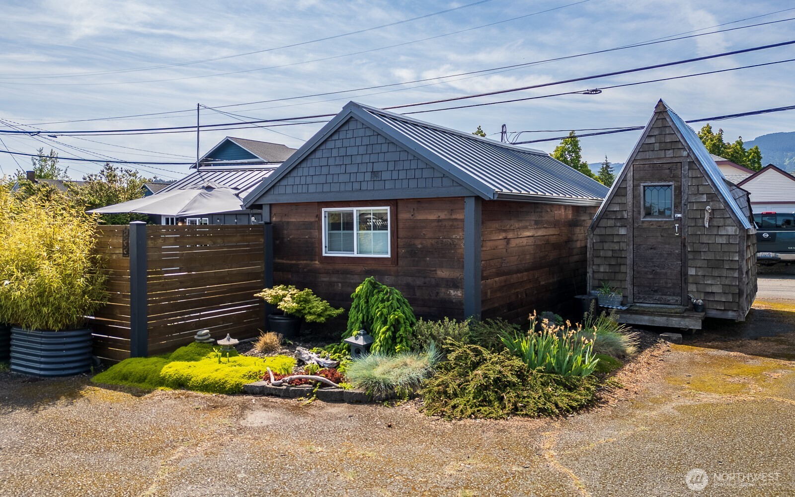 233 West Washington Street Sequim, WA 98382 - Photo 29 of 40 a view of a house that has a small yard plants and large tree