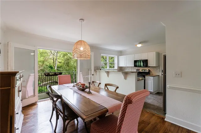 a view of a dining room with furniture window and outside view