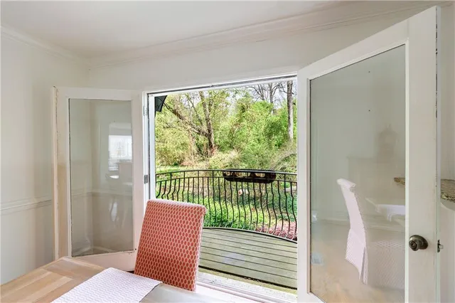 a bedroom with bed and a window