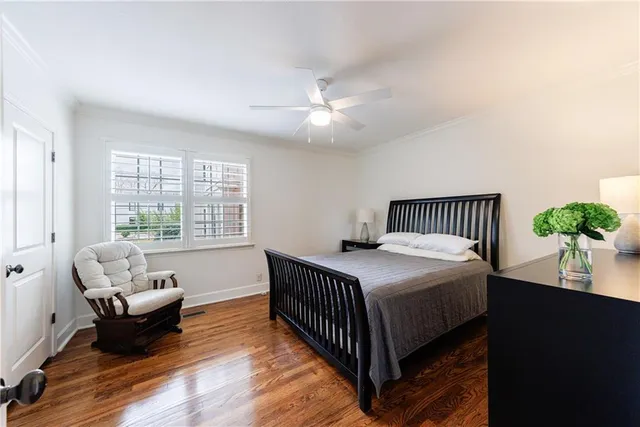 a bathroom with a sink toilet and a mirror