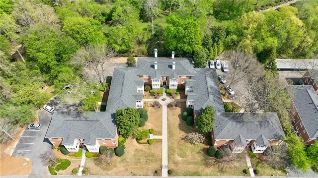 an aerial view of multiple houses with yard