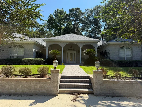 a front view of a house with swimming pool