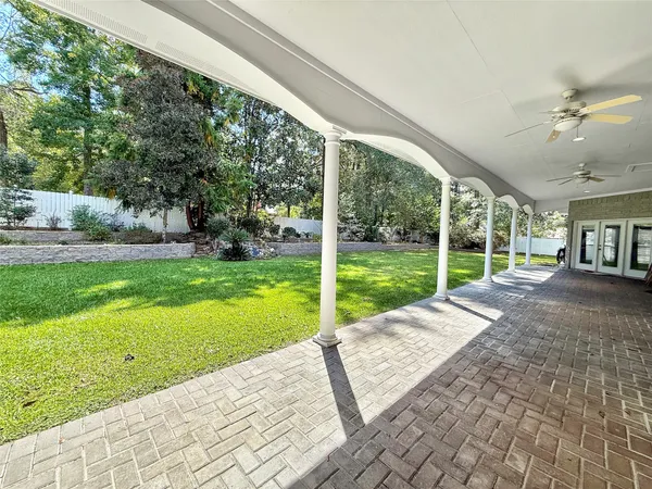 a view of a house with backyard and porch