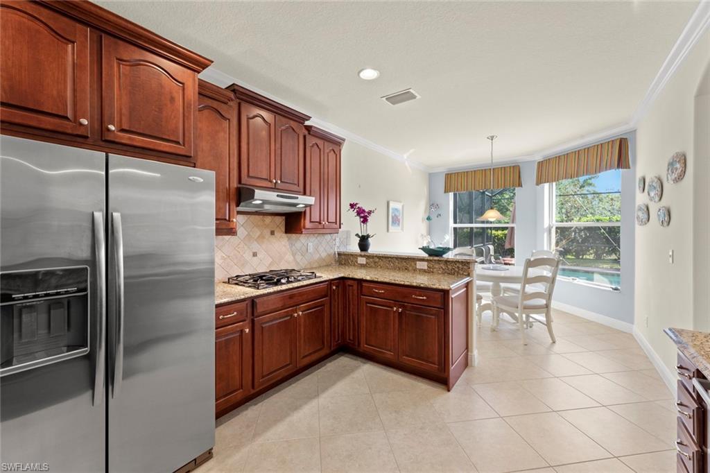 19900 Maddelena Circle Estero, FL 33967 - Photo 16 of 42 Kitchen looking out towards lanai