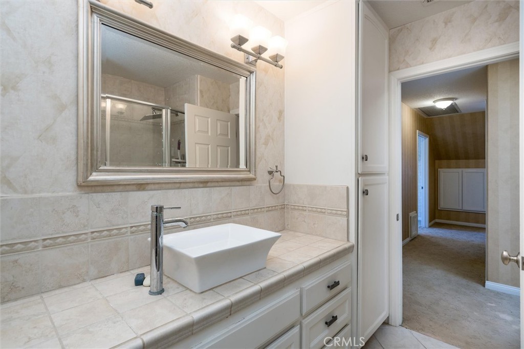 34150 Stowe Road Winchester, CA 92545 - Photo 33 of 80 a bathroom with a sink and a mirror
