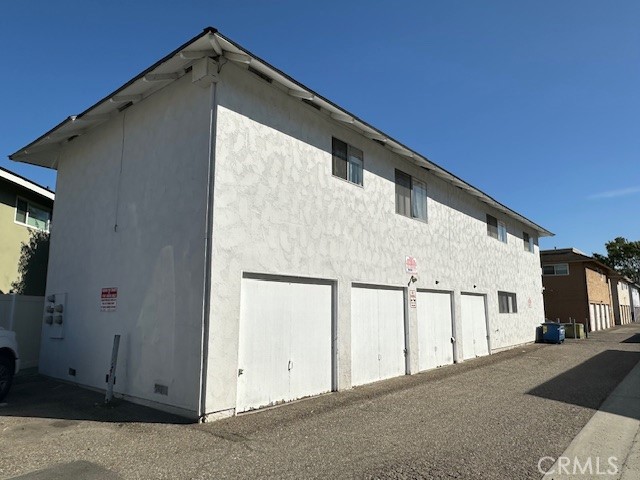 17061 Grove Circle, Unit A Huntington Beach, CA 92647 - Photo 2 of 30 a view of house with garage