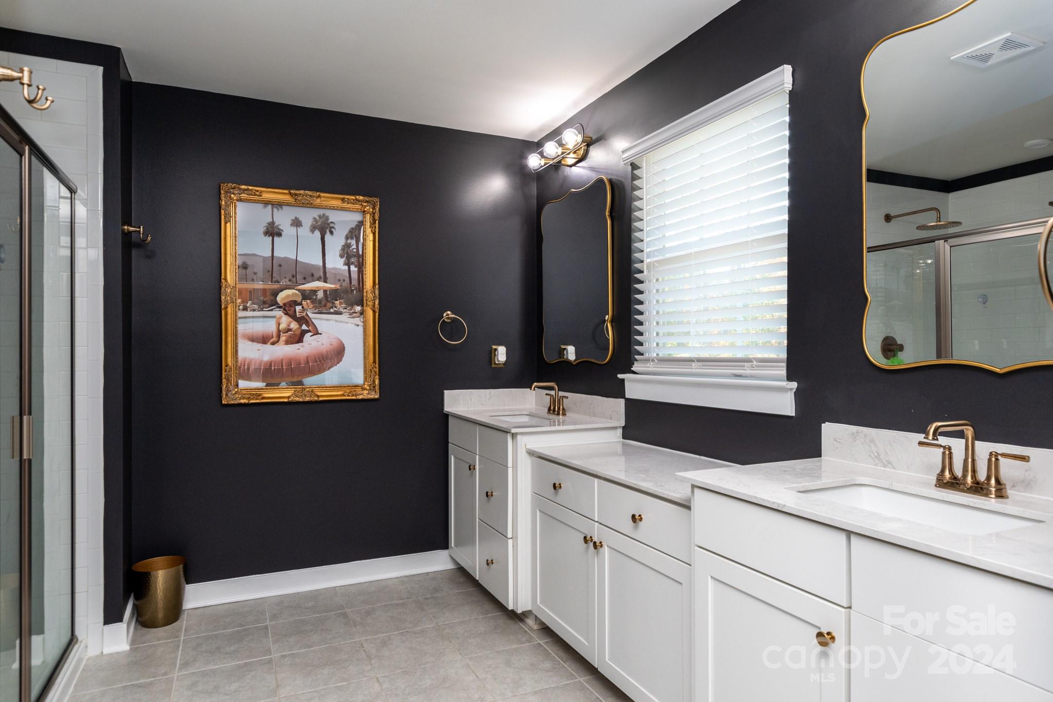 14306 Sunnyhill Grove Road Davidson, NC 28036 - Photo 16 of 35 a bathroom with a sink vanity and mirror