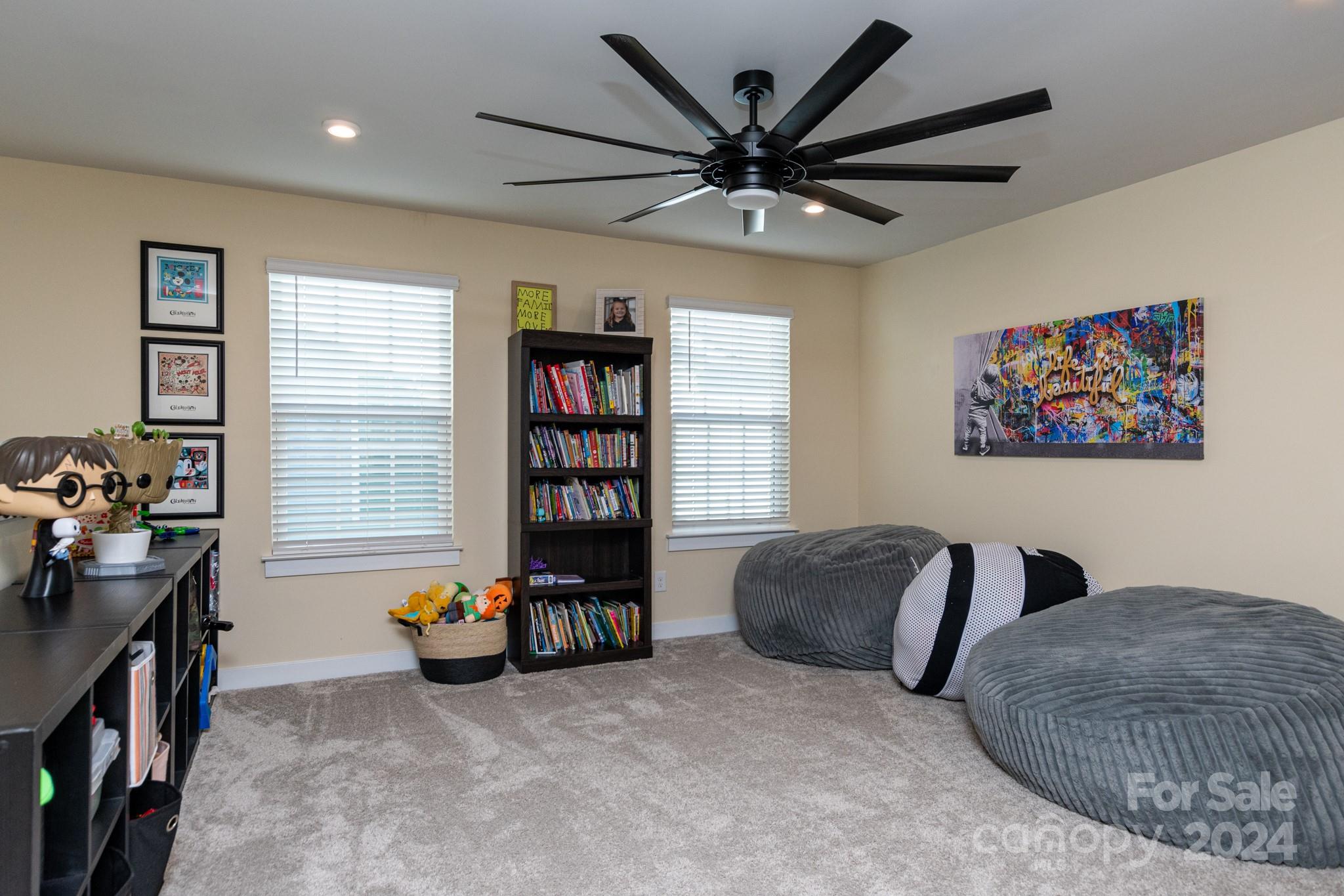 14306 Sunnyhill Grove Road Davidson, NC 28036 - Photo 22 of 35 a livingroom with a workspace and a couch