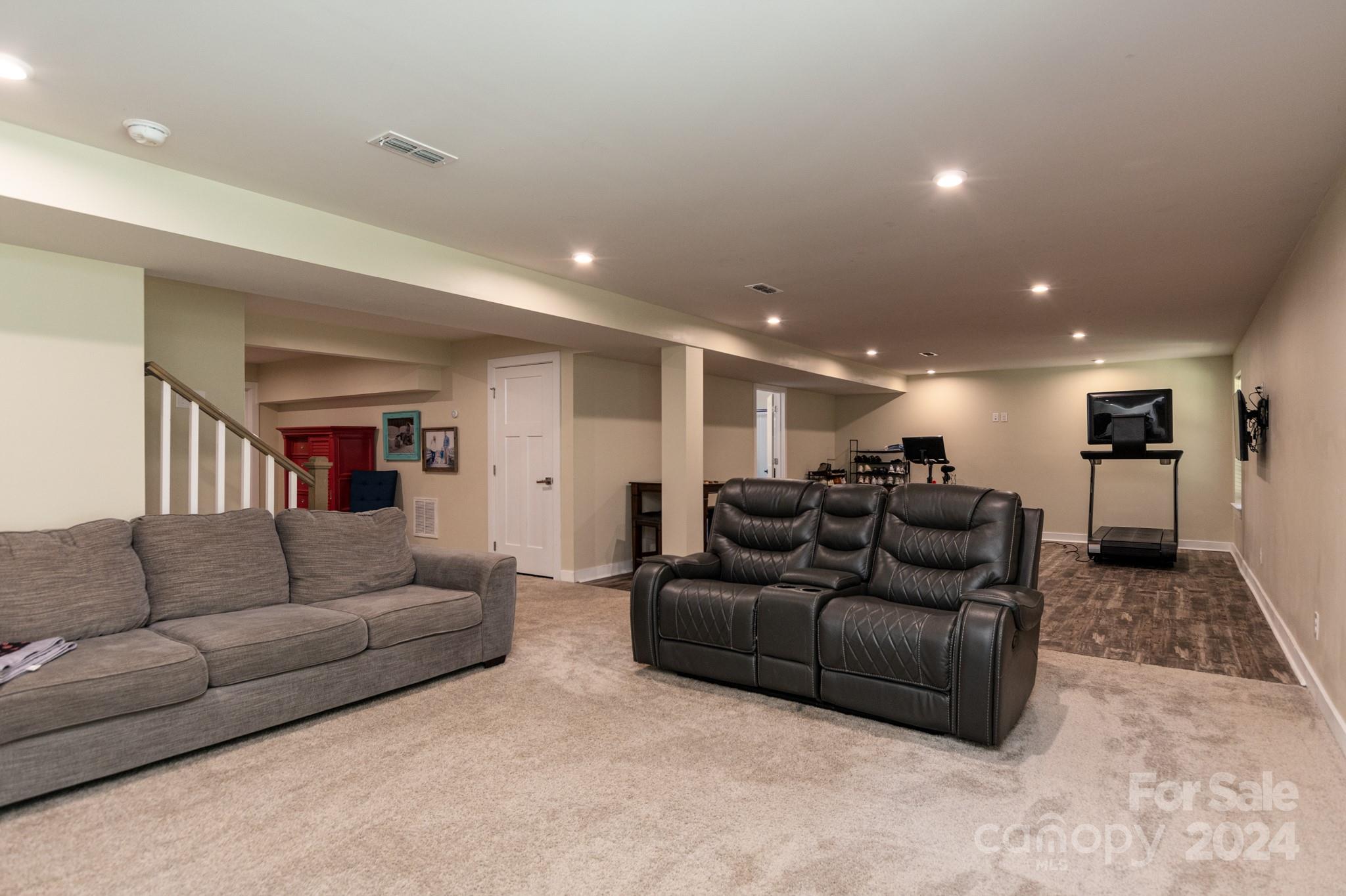 14306 Sunnyhill Grove Road Davidson, NC 28036 - Photo 27 of 35 a living room with furniture and a couch