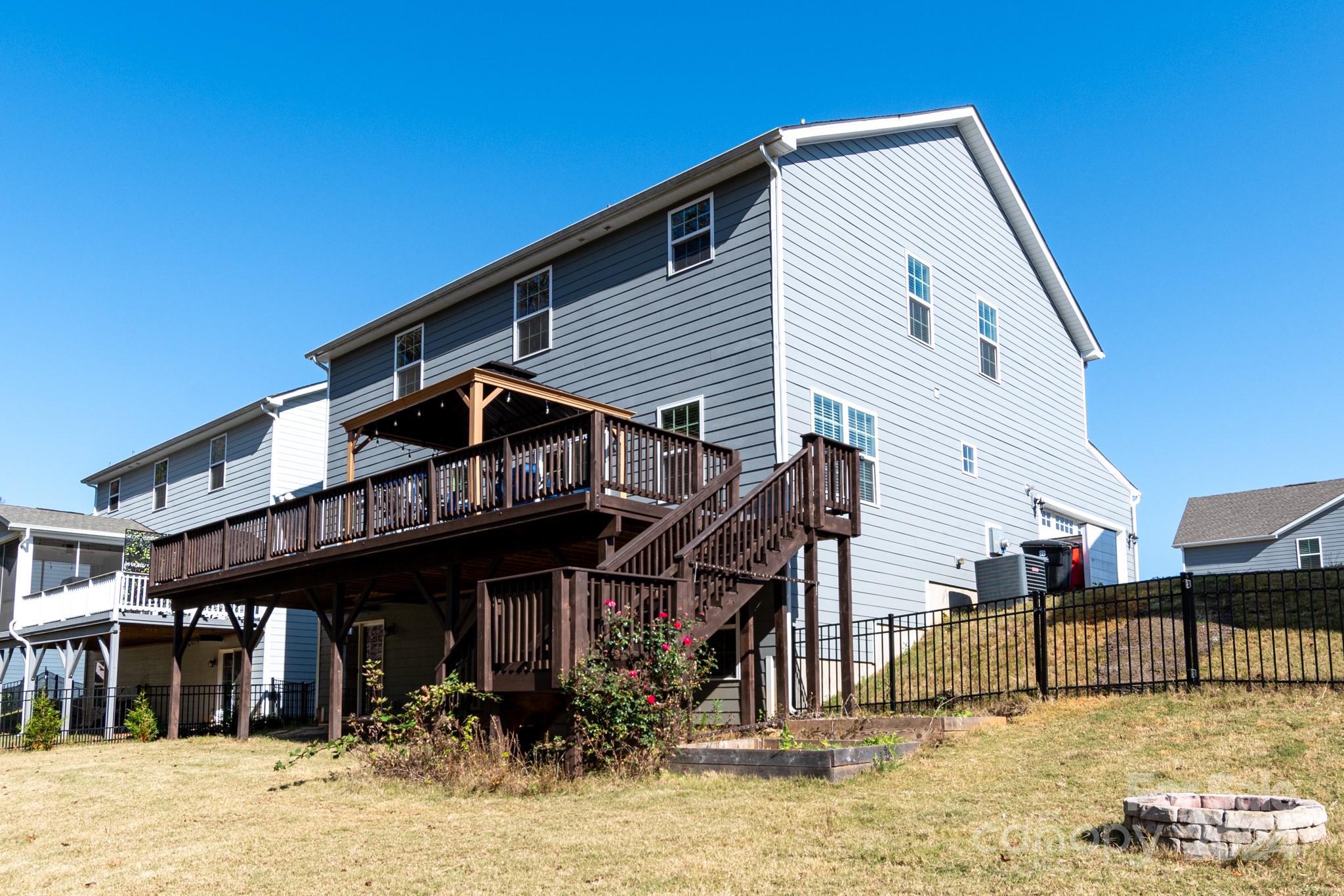 14306 Sunnyhill Grove Road Davidson, NC 28036 - Photo 29 of 35 a view of a house with a swimming pool