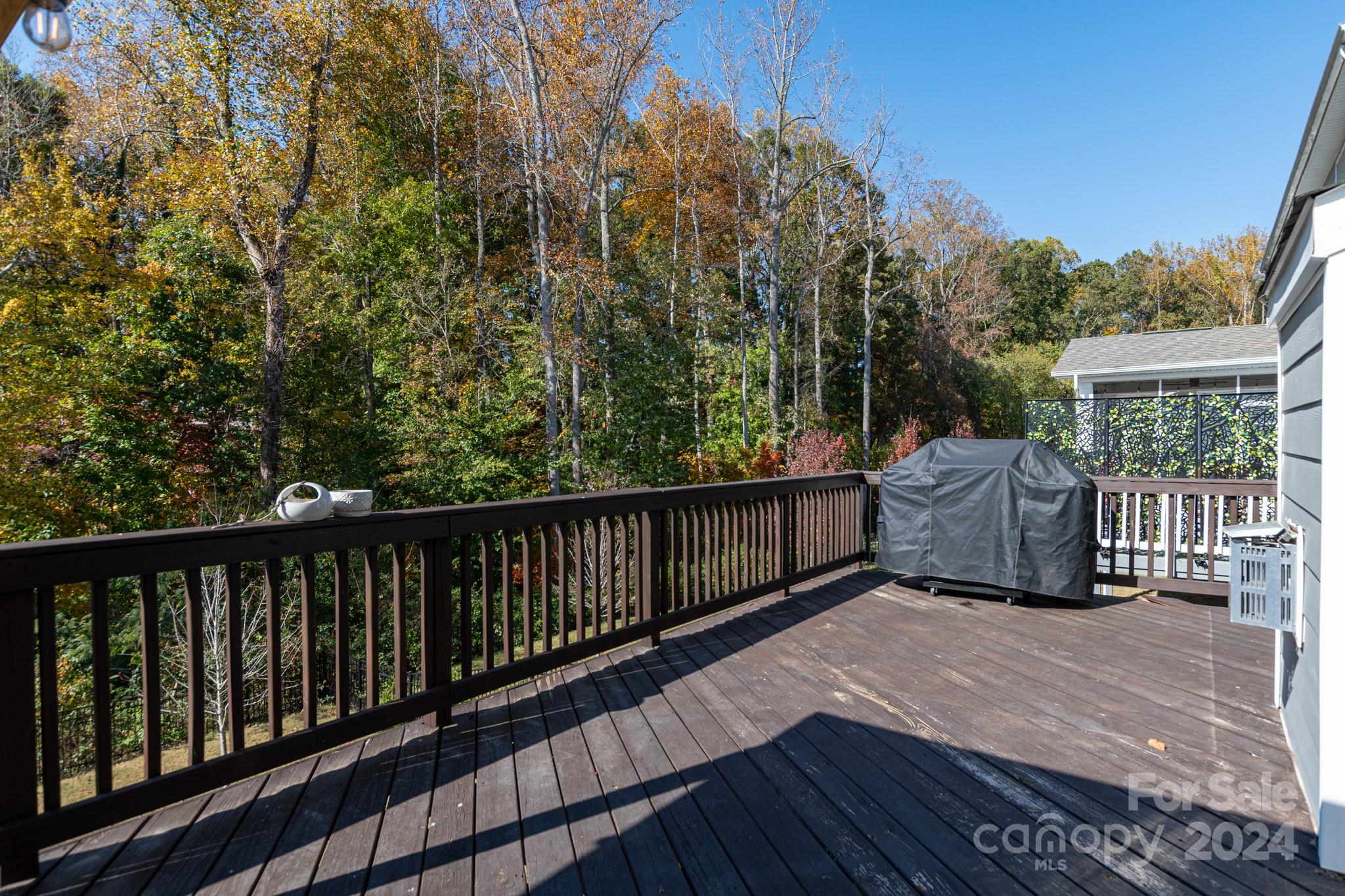 14306 Sunnyhill Grove Road Davidson, NC 28036 - Photo 34 of 35 a balcony with wooden floor and fence