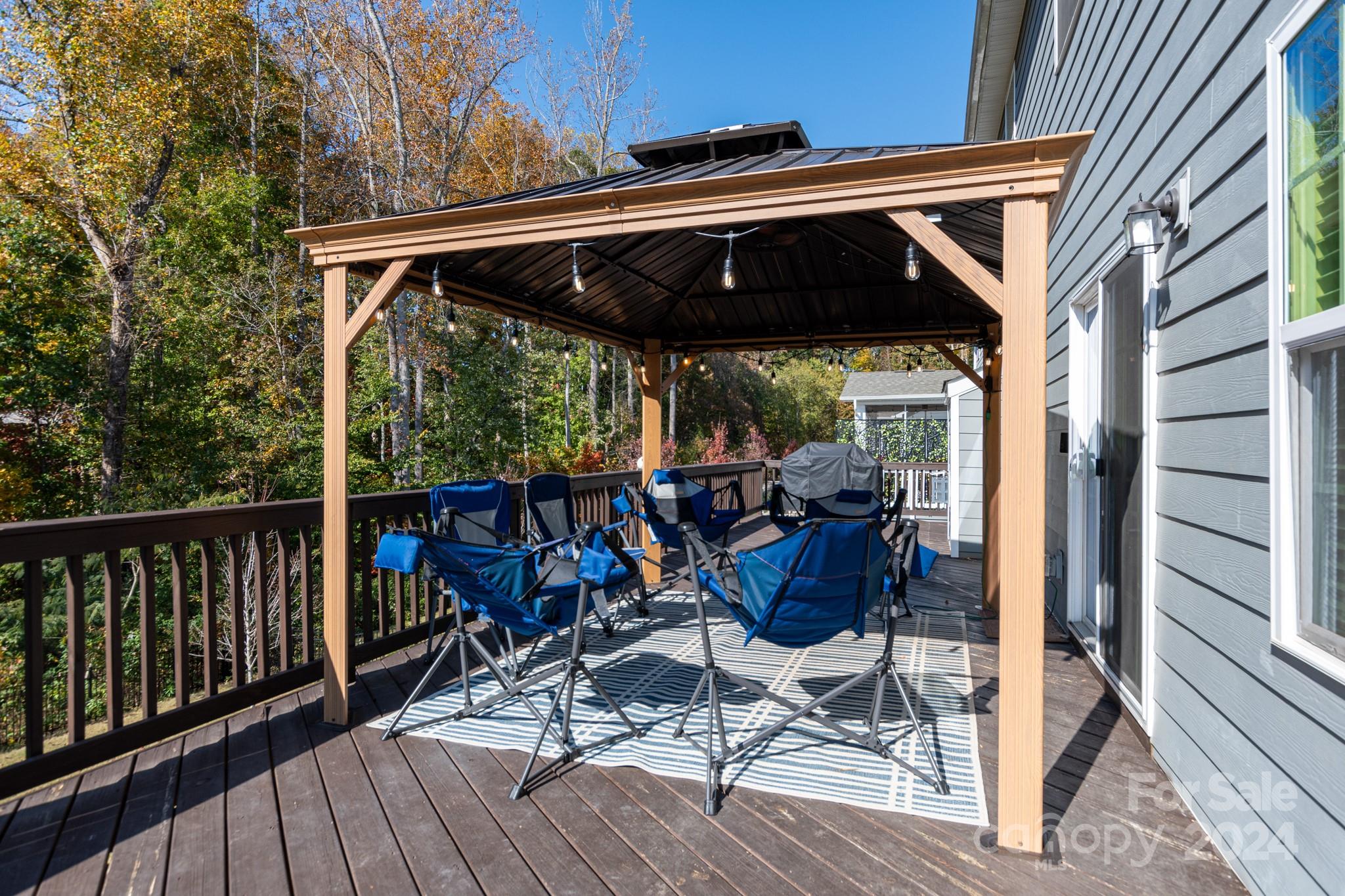 14306 Sunnyhill Grove Road Davidson, NC 28036 - Photo 35 of 35 a view of porch with chairs and wooden floor