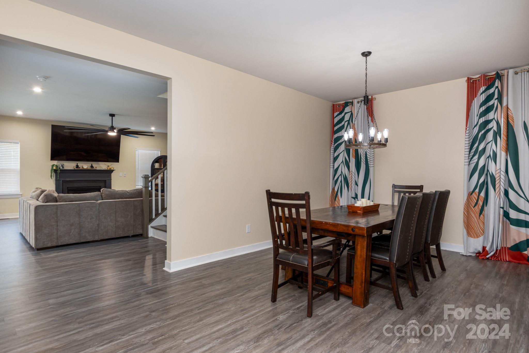 14306 Sunnyhill Grove Road Davidson, NC 28036 - Photo 7 of 35 a view of a dining room with furniture and wooden floor