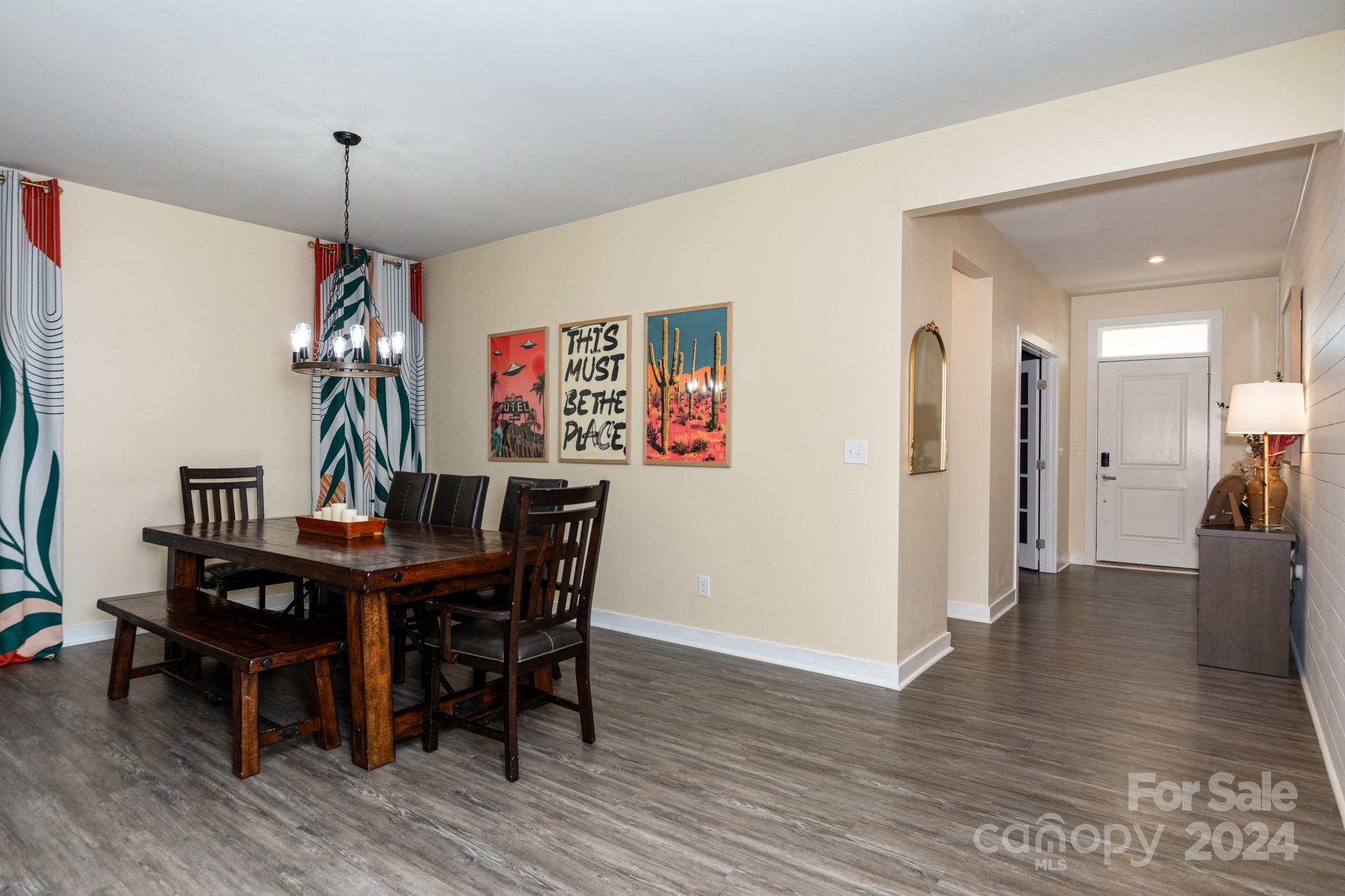 14306 Sunnyhill Grove Road Davidson, NC 28036 - Photo 8 of 35 a view of a dining room with furniture wooden floor and a chandelier