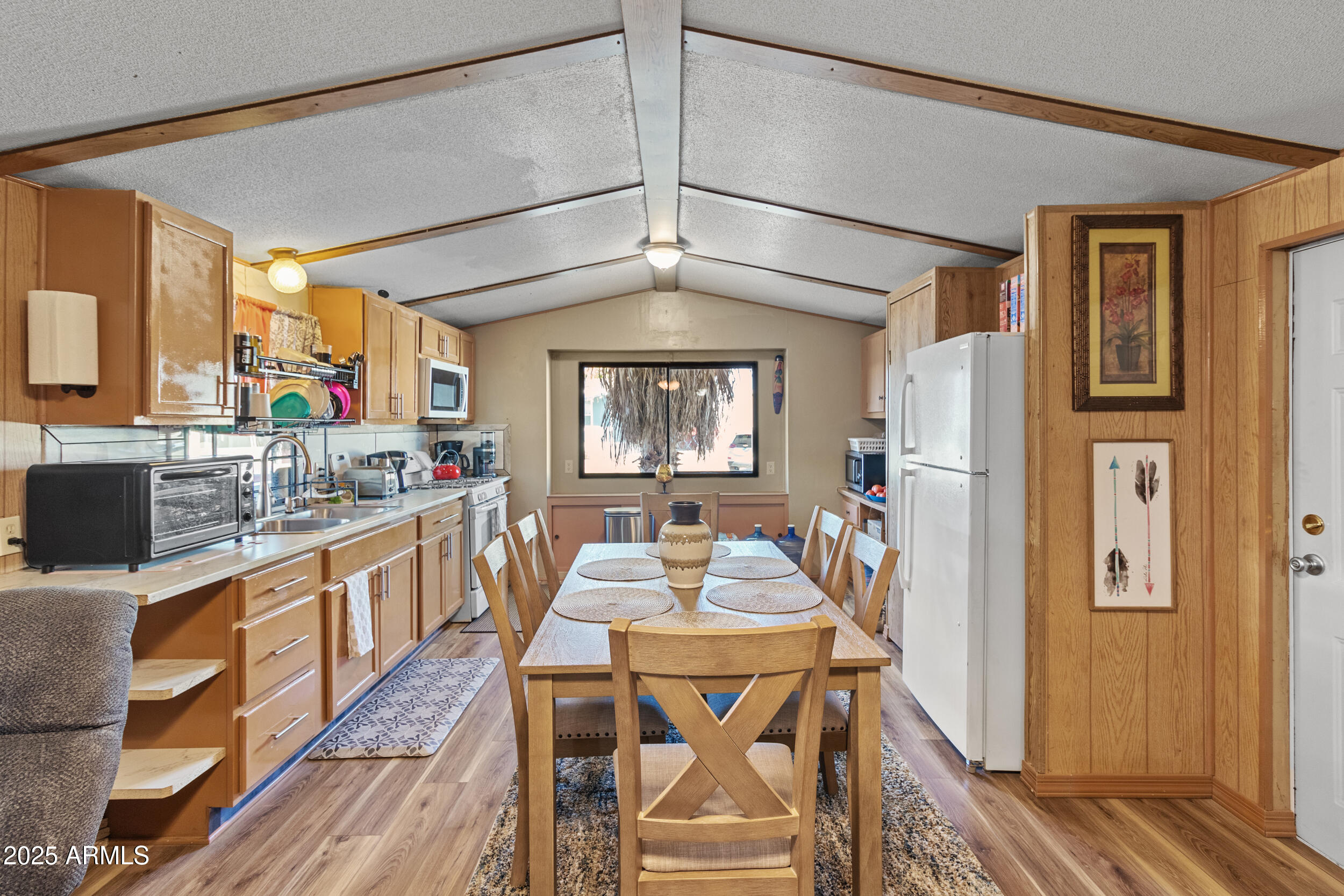 a view of a dining room with furniture and window