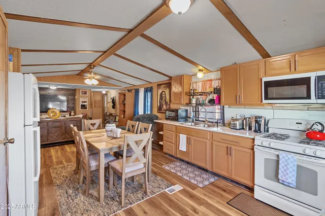 a kitchen with lots of counter top space and dining table