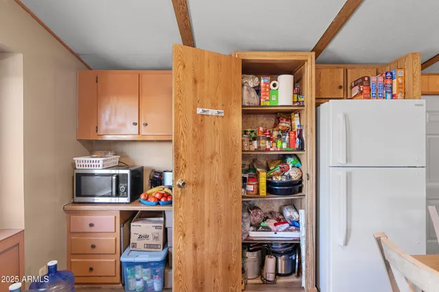 a kitchen with stainless steel appliances granite countertop a sink dishwasher stove and cabinets