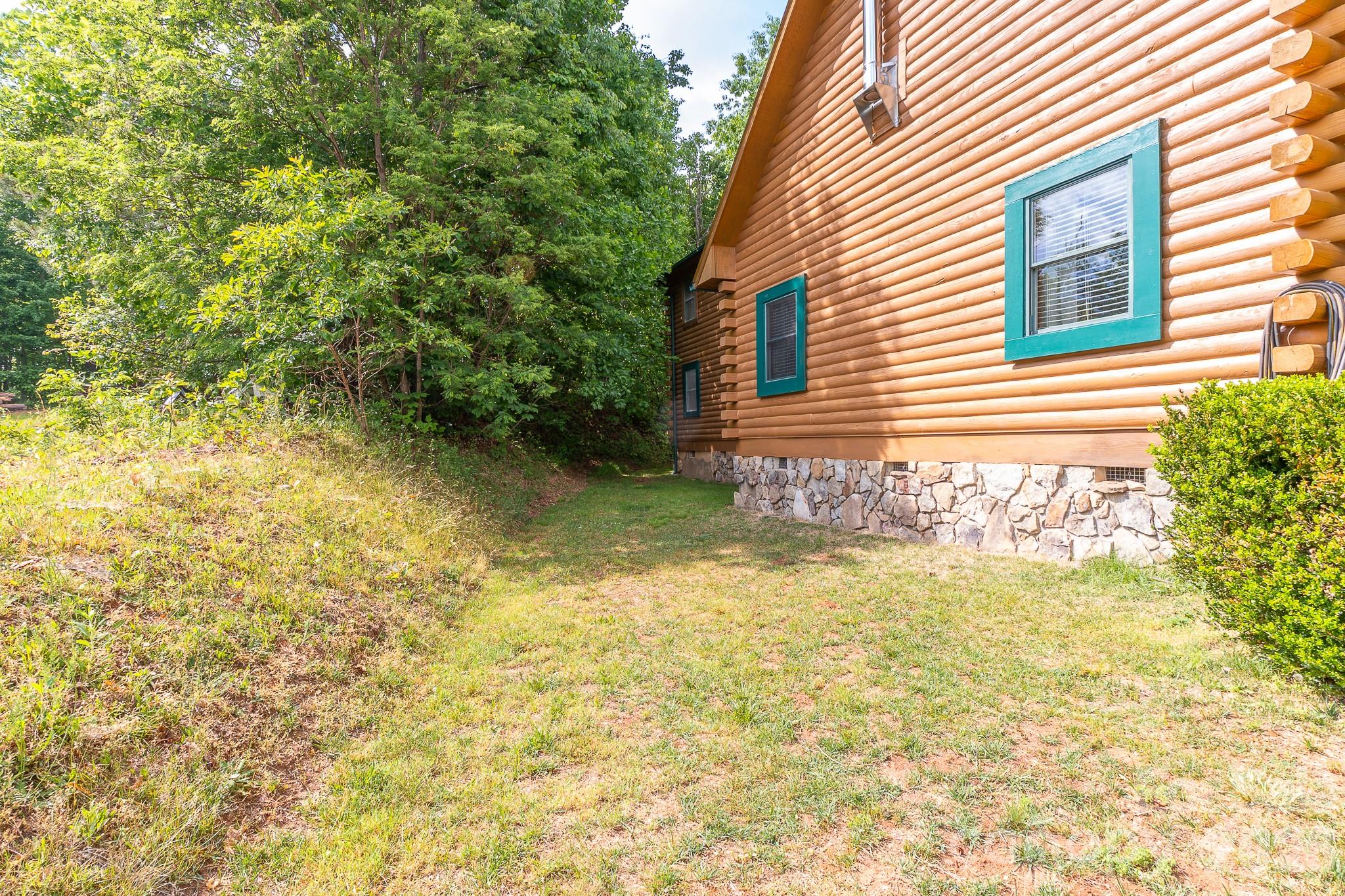 451 Rustic Ridge Drive Canton, NC 28716 - Photo 33 of 44 a view of a house with pool and trees