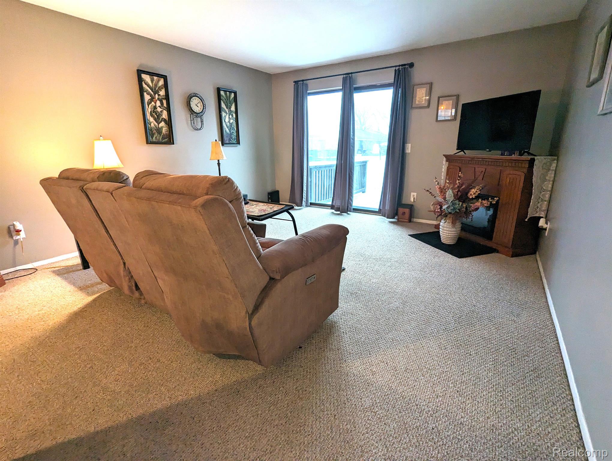 57287 Beaconsfield Road, Unit 36 Washington, MI 48094 - Photo 6 of 15 Door to private deck off living room