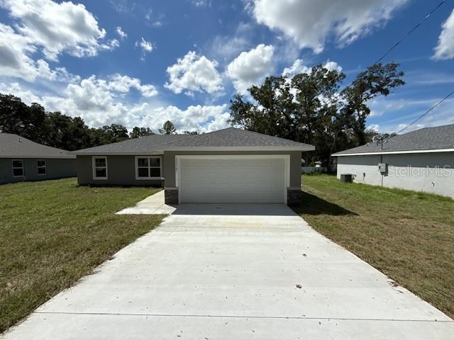 17574 Southwest 112th Place Dunnellon, FL 34432 - Photo 2 of 26 a front view of a house with garden