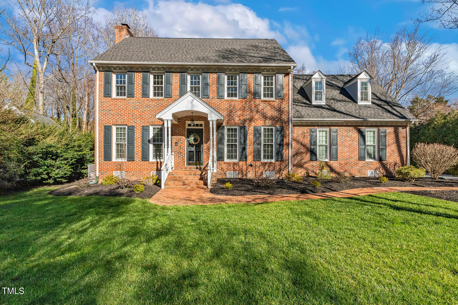 6320 Bayswater Trail Raleigh, NC 27612 - Photo 1 of 62 a front view of a house with a yard table and chairs