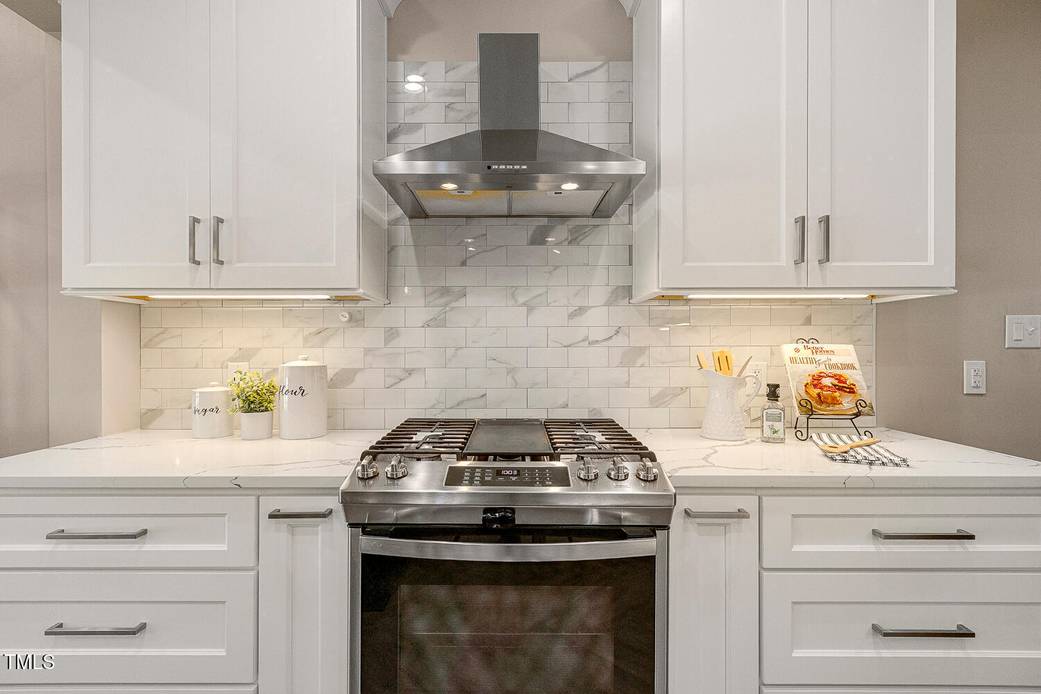 6320 Bayswater Trail Raleigh, NC 27612 - Photo 12 of 62 a kitchen with a stove and cabinets