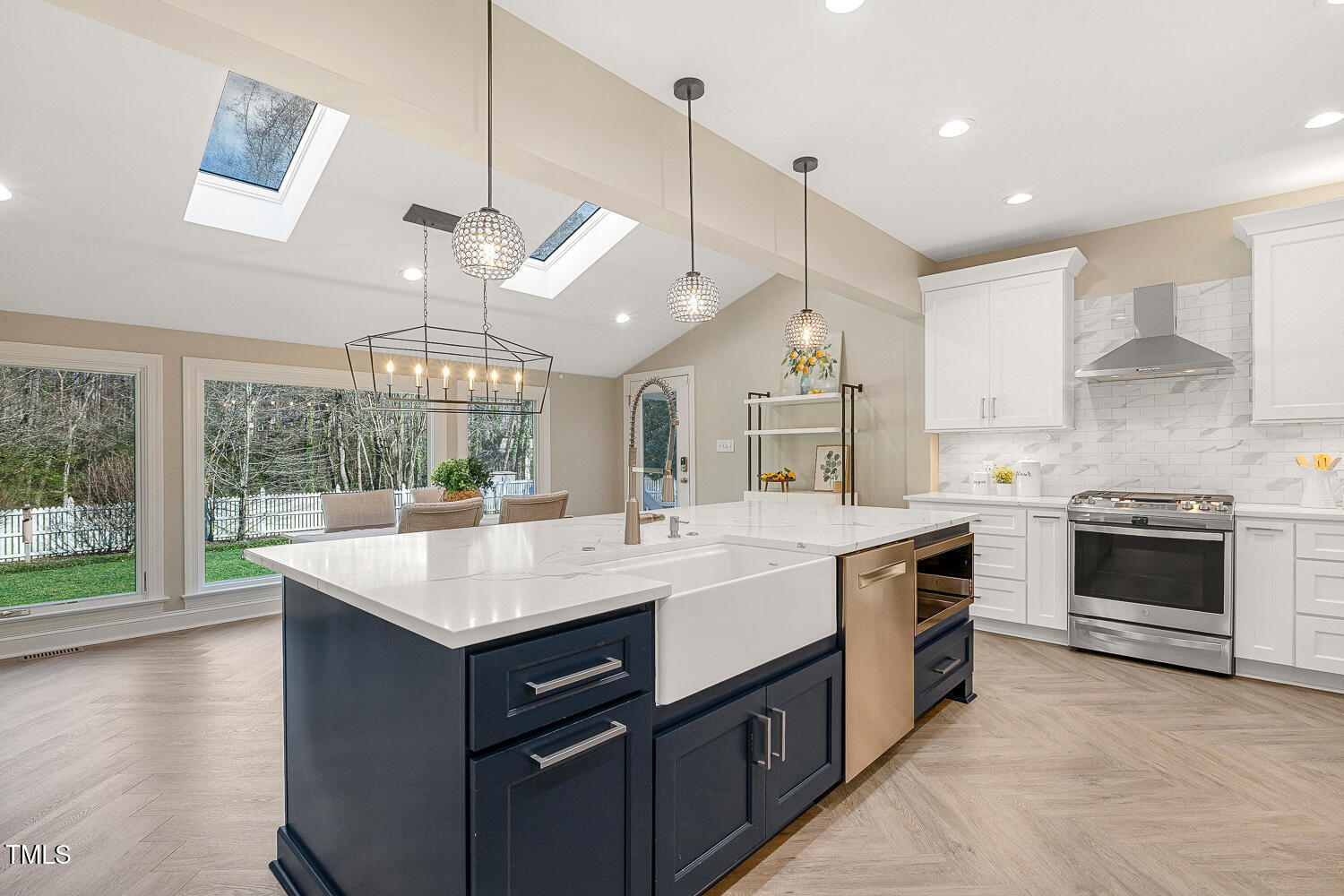 6320 Bayswater Trail Raleigh, NC 27612 - Photo 14 of 62 a kitchen with a stove and a view of living room