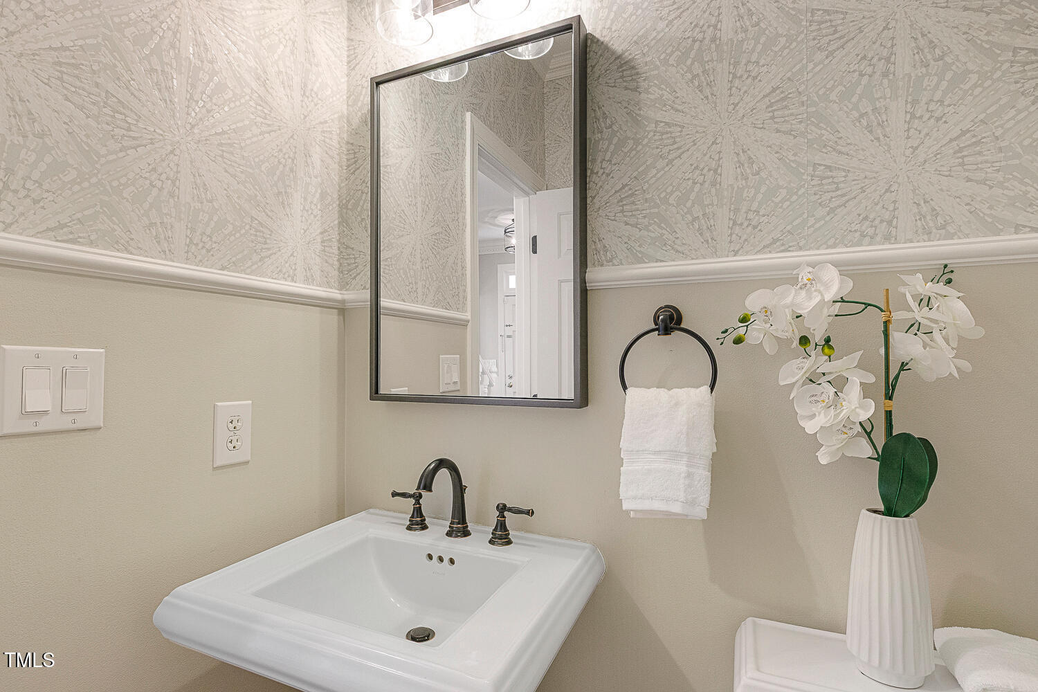 6320 Bayswater Trail Raleigh, NC 27612 - Photo 31 of 62 a bathroom with a toilet sink and mirror