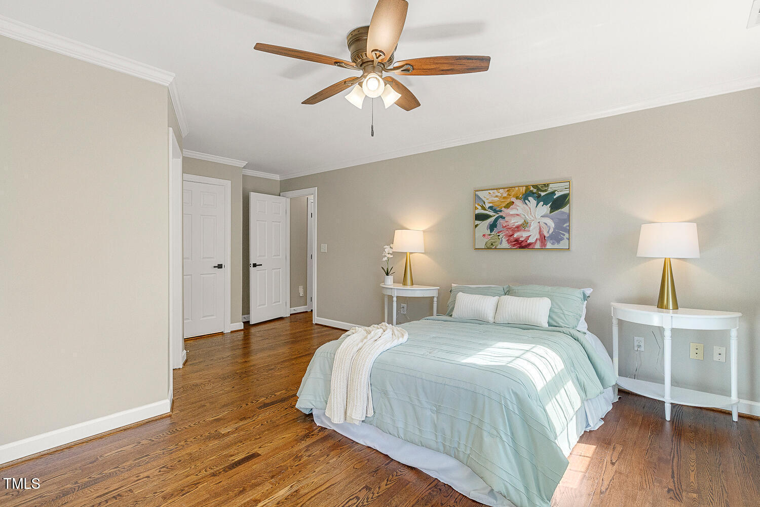 6320 Bayswater Trail Raleigh, NC 27612 - Photo 33 of 62 a bedroom with a bed and a chandelier