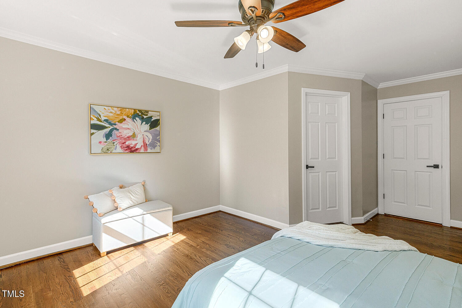 6320 Bayswater Trail Raleigh, NC 27612 - Photo 36 of 62 a bedroom with a bed and a chandelier
