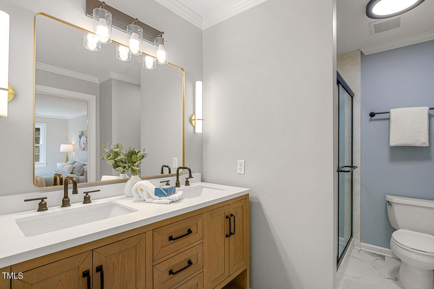 6320 Bayswater Trail Raleigh, NC 27612 - Photo 38 of 62 a bathroom with a sink a toilet a mirror and shower