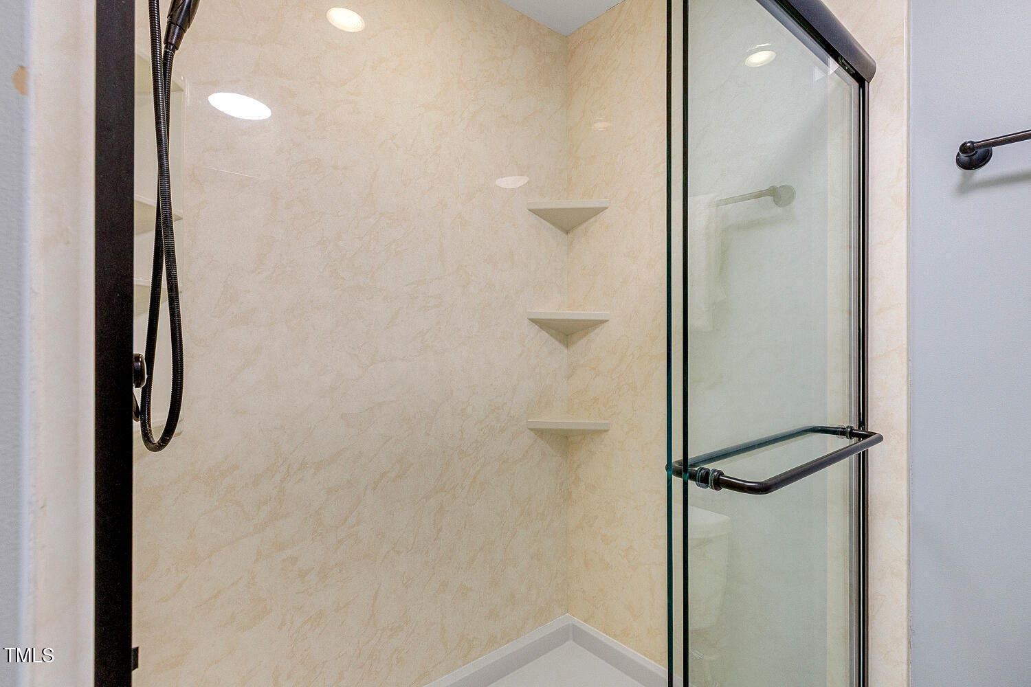 6320 Bayswater Trail Raleigh, NC 27612 - Photo 39 of 62 a bathroom with a glass shower door