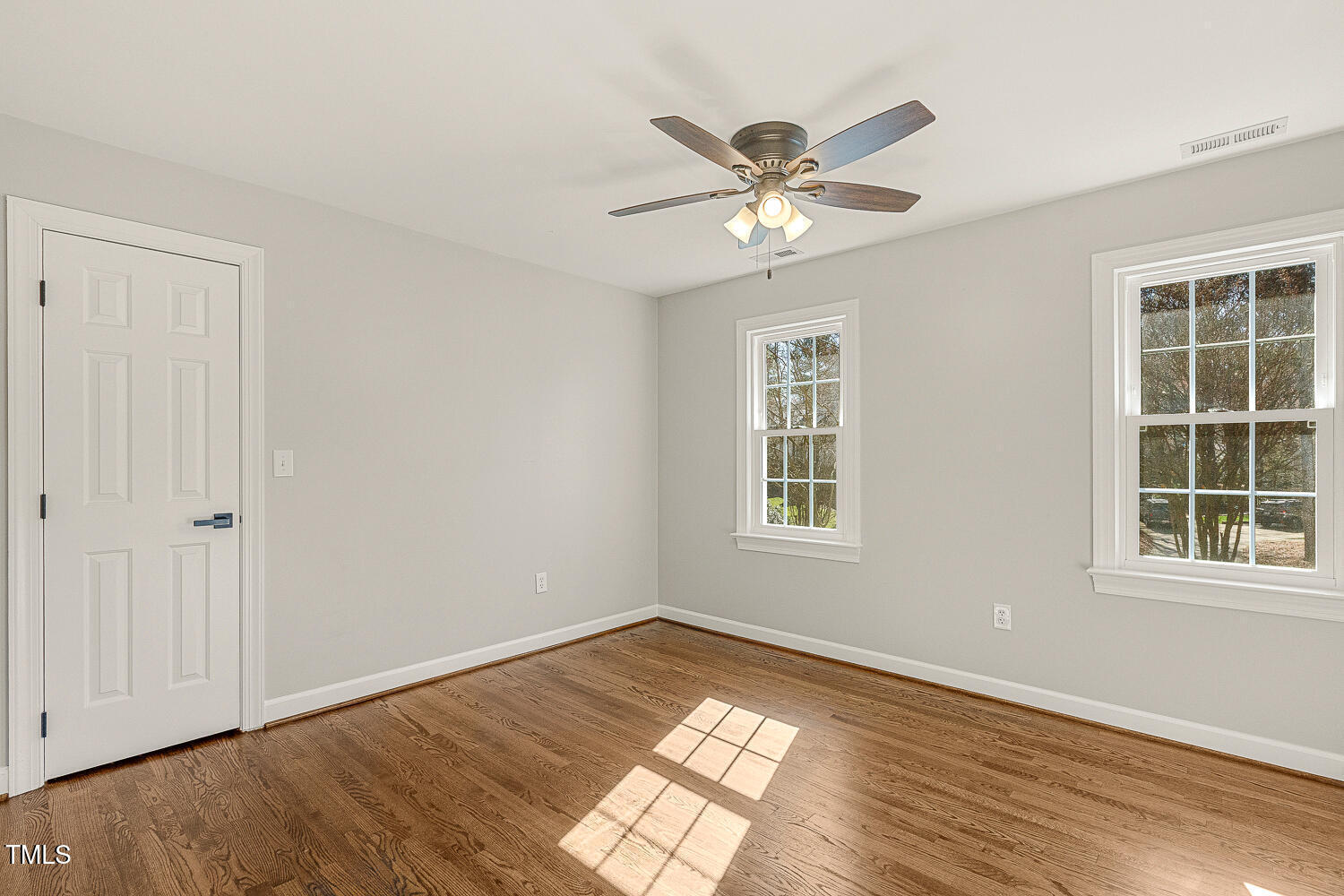 6320 Bayswater Trail Raleigh, NC 27612 - Photo 45 of 62 a view of a big room with wooden floor and windows
