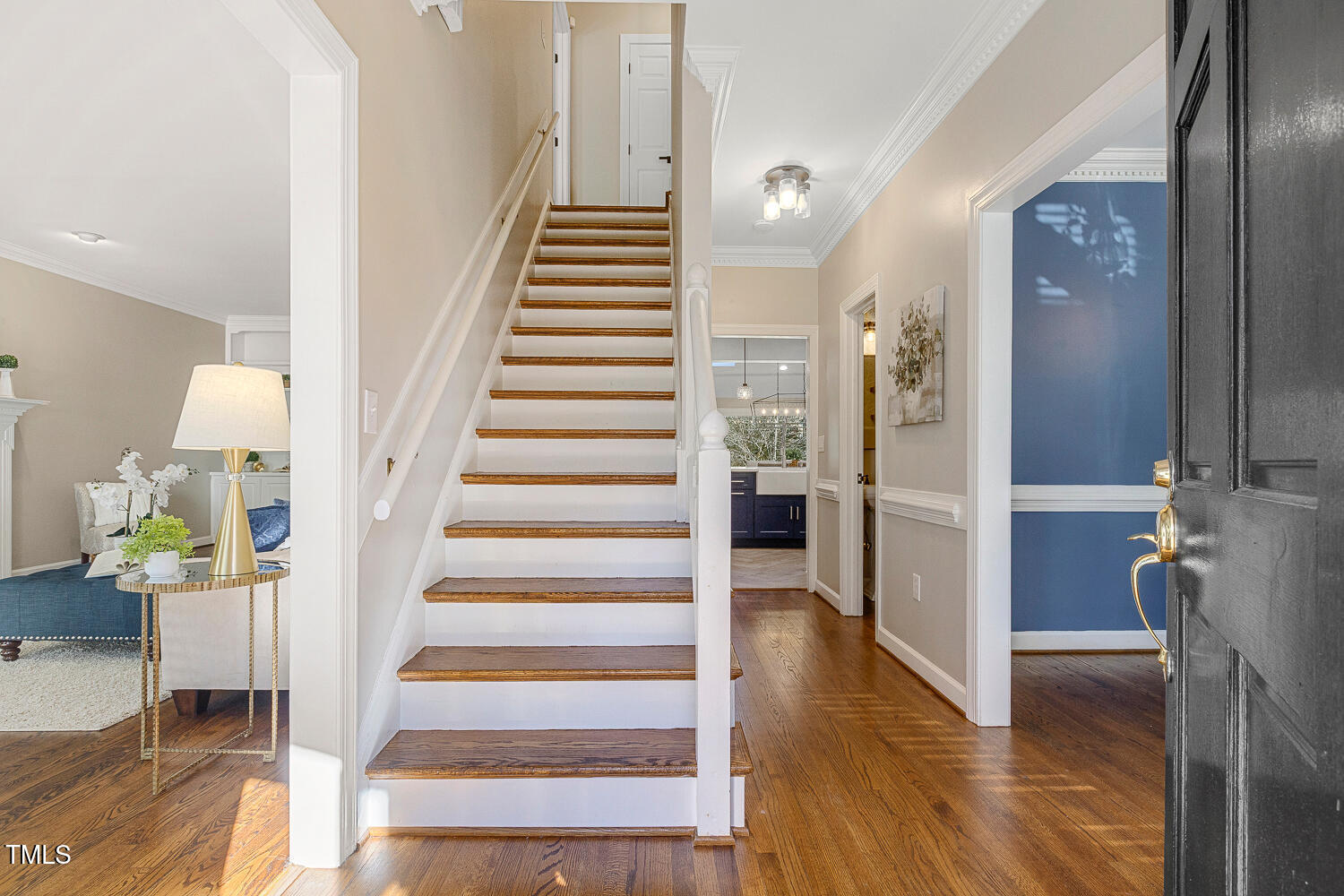 6320 Bayswater Trail Raleigh, NC 27612 - Photo 6 of 62 a view of an entryway with wooden floor and a livingroom view