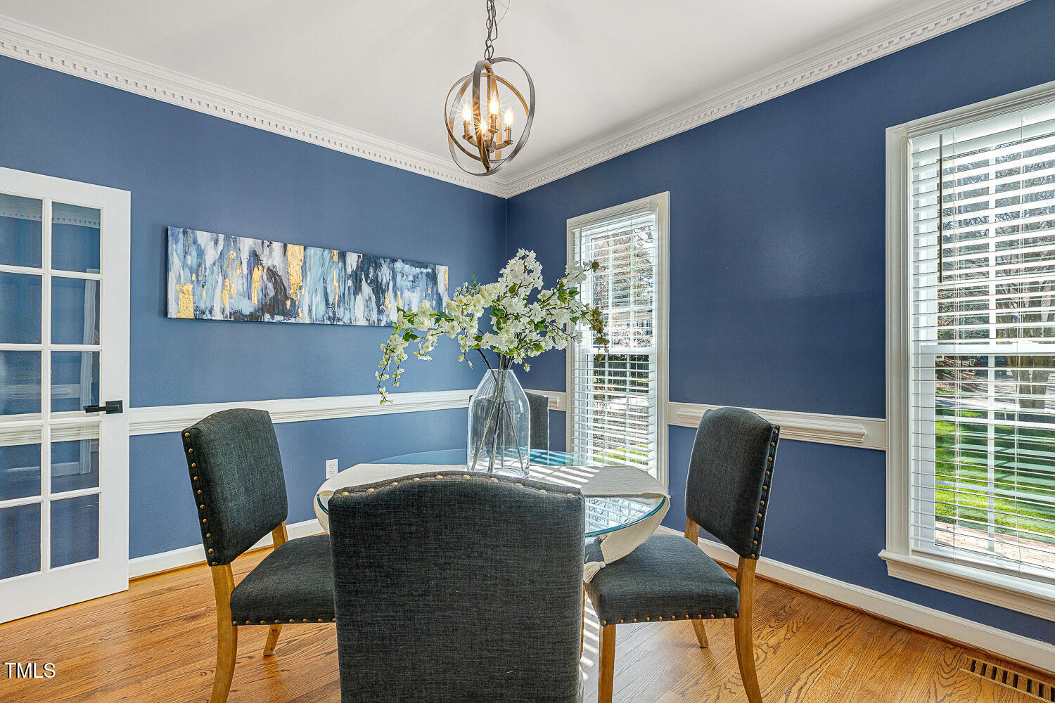 6320 Bayswater Trail Raleigh, NC 27612 - Photo 9 of 62 a dining room with furniture potted plants and wooden floor