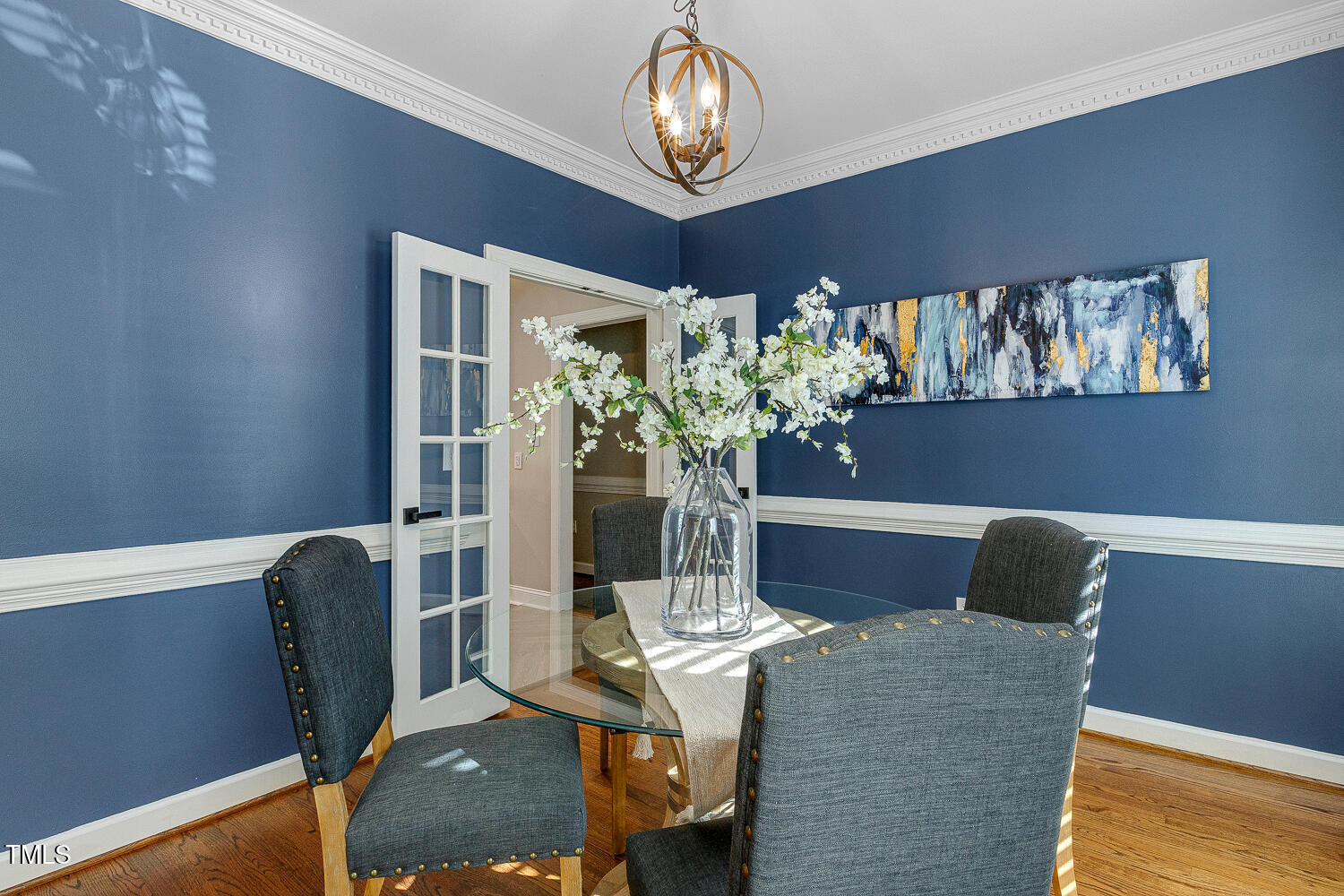 6320 Bayswater Trail Raleigh, NC 27612 - Photo 10 of 62 a dining room with furniture and a chandelier