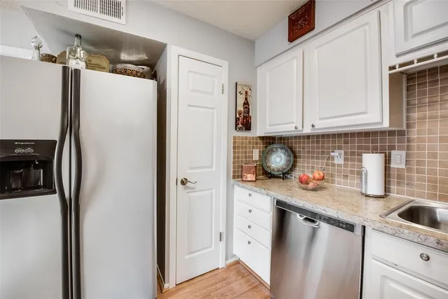 a bathroom with a granite countertop sink mirror toilet and shower