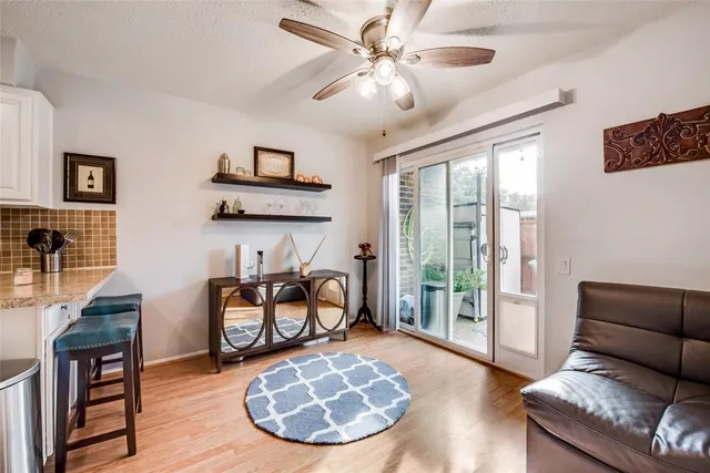 a kitchen with stainless steel appliances a refrigerator stove microwave and white cabinets