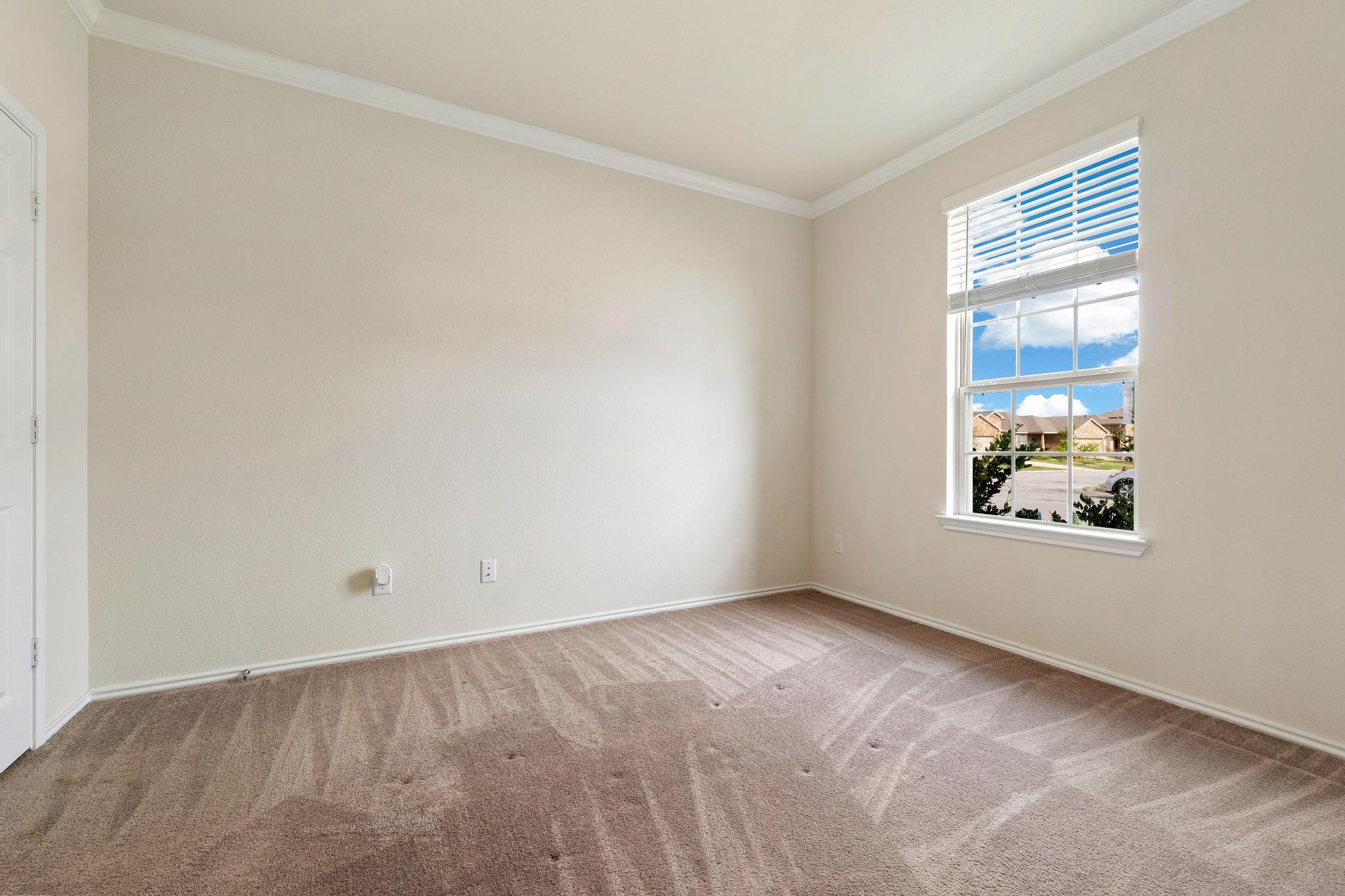 217 Innisfree Road Jarrell, TX 76537 - Photo 5 of 39 A dedicated home office space with ample natural light offers a tranquil work environment.
