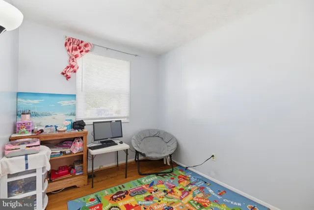 a workspace with furniture and a rug