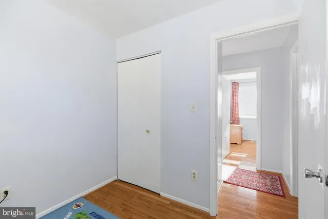 a view of room with wooden floor