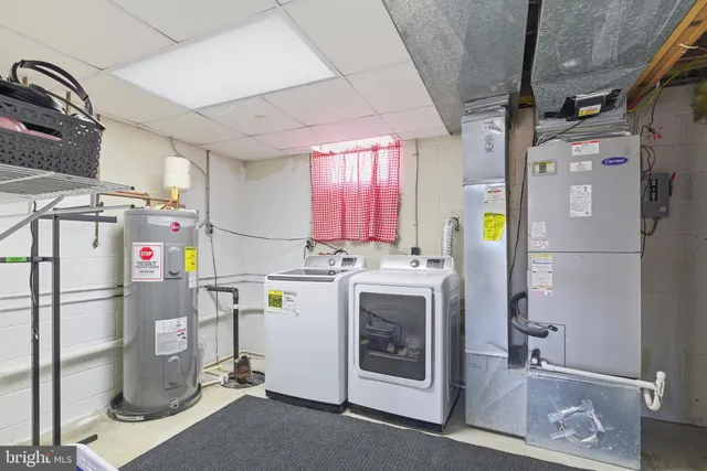 a view of storage and utility room with washer and dryer