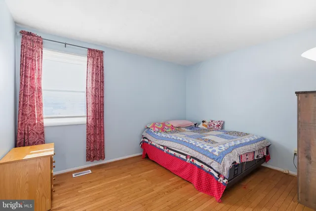 a bedroom with a bed and a table