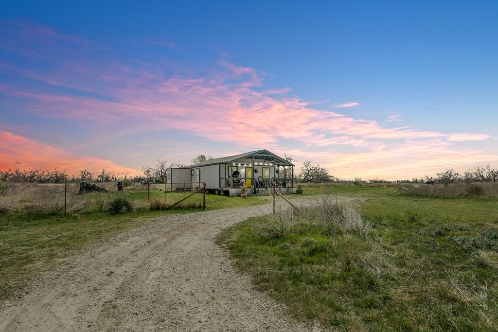 3527 Old Harper Road Fredericksburg, TX 78624 - Photo 2 of 41 a view of a lake with a yard