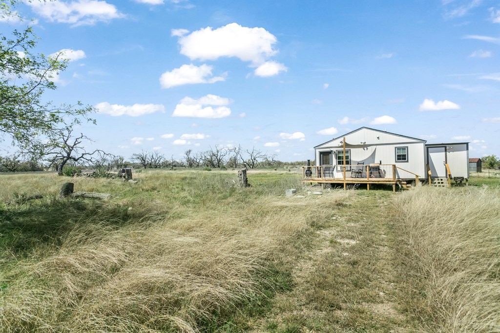 3527 Old Harper Road Fredericksburg, TX 78624 - Photo 31 of 41 a front view of a house with garden