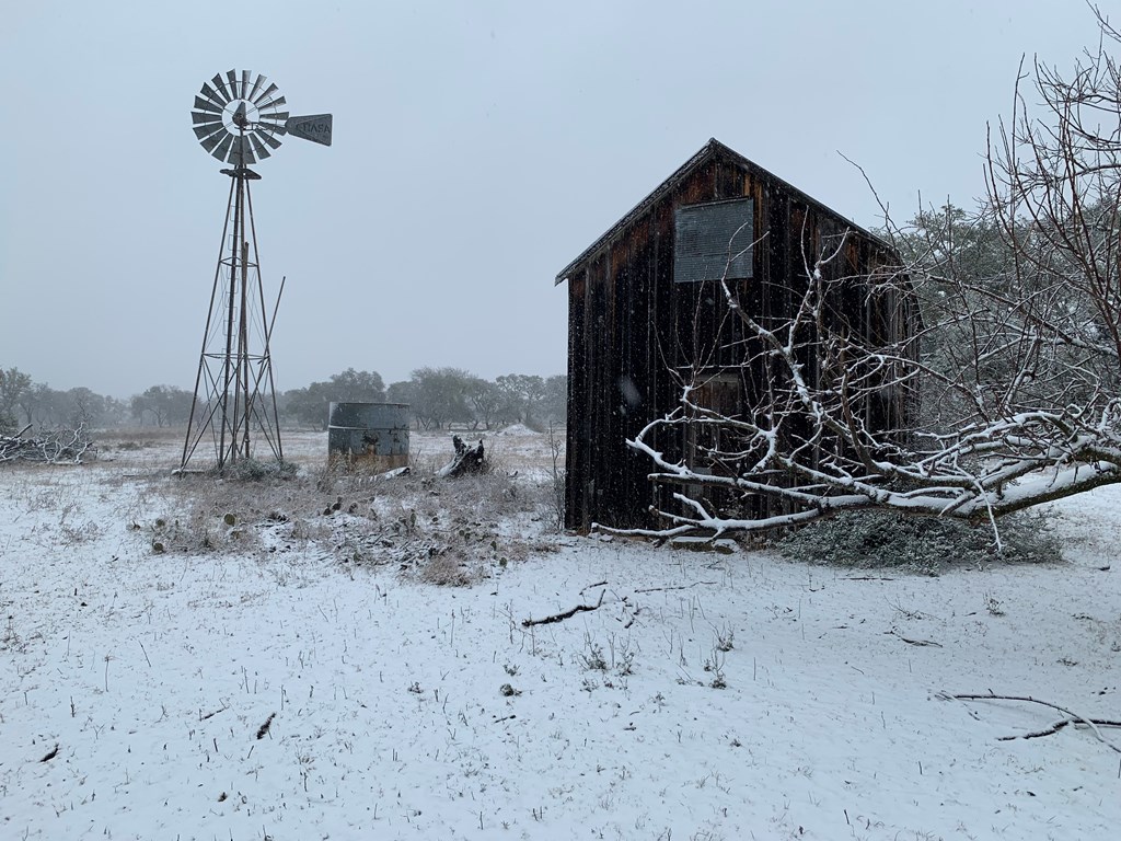 3527 Old Harper Road Fredericksburg, TX 78624 - Photo 34 of 41 a view of a house with a snow in the yard