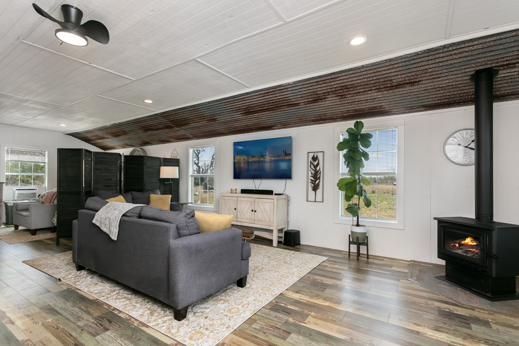 3527 Old Harper Road Fredericksburg, TX 78624 - Photo 9 of 41 a living room with furniture and a flat screen tv