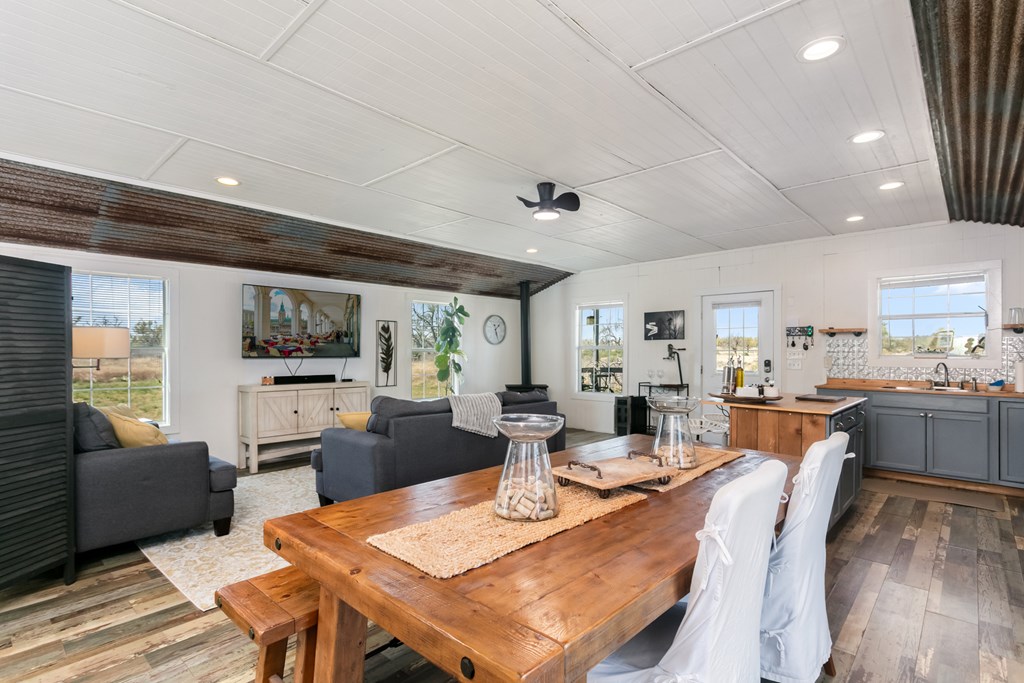 3527 Old Harper Road Fredericksburg, TX 78624 - Photo 10 of 41 a view of a dining room with furniture window and wooden floor