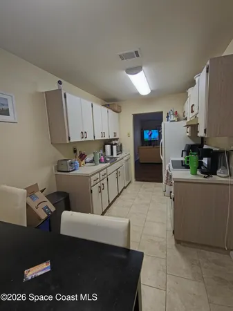 a kitchen with stainless steel appliances a stove a sink and a refrigerator
